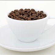 Picture Of Natural Coffee Beans And White Cup